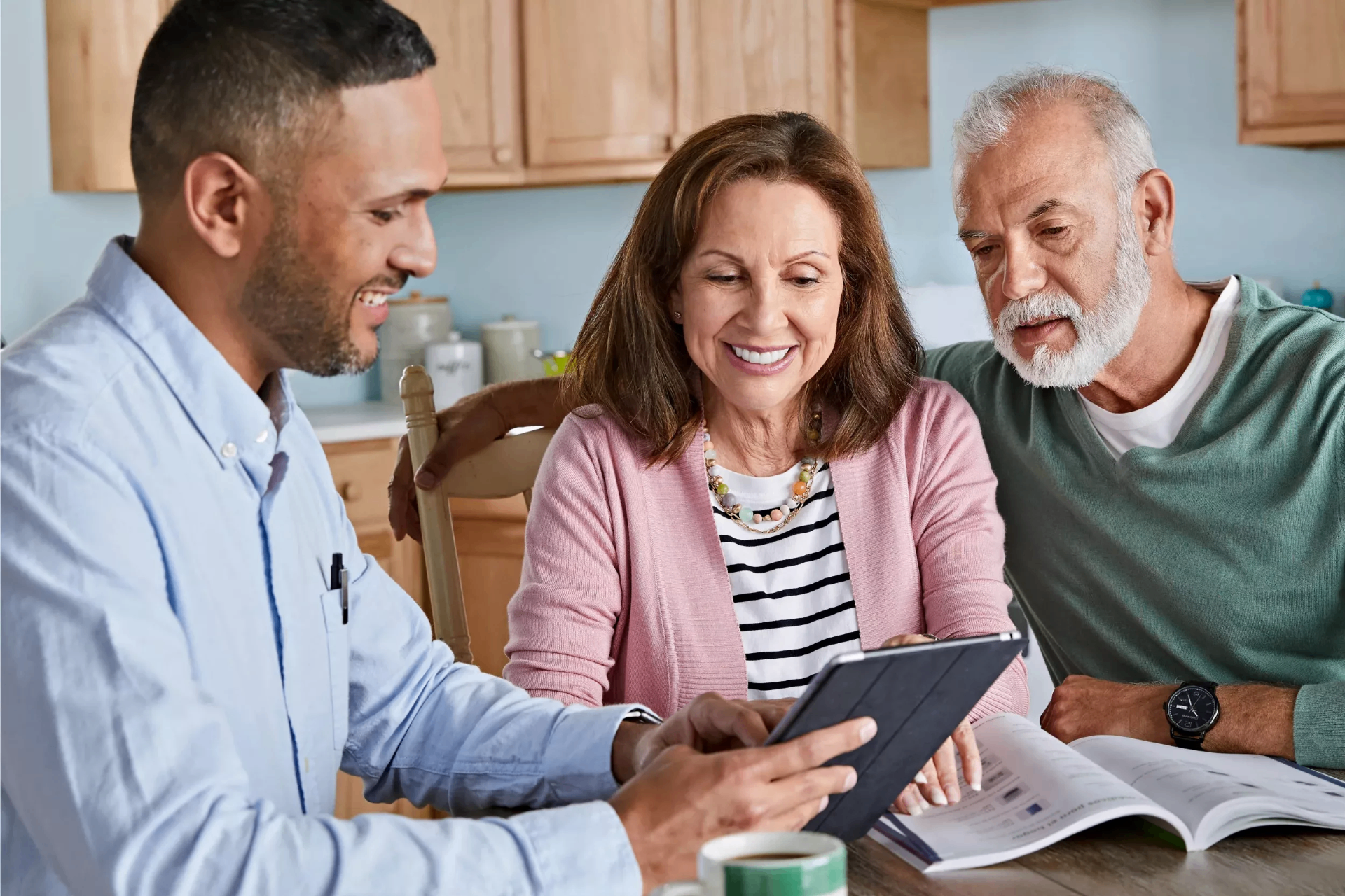 Birch Corp Health advisor reviewing Medicare and health plan options with an Iowa couple at their kitchen table