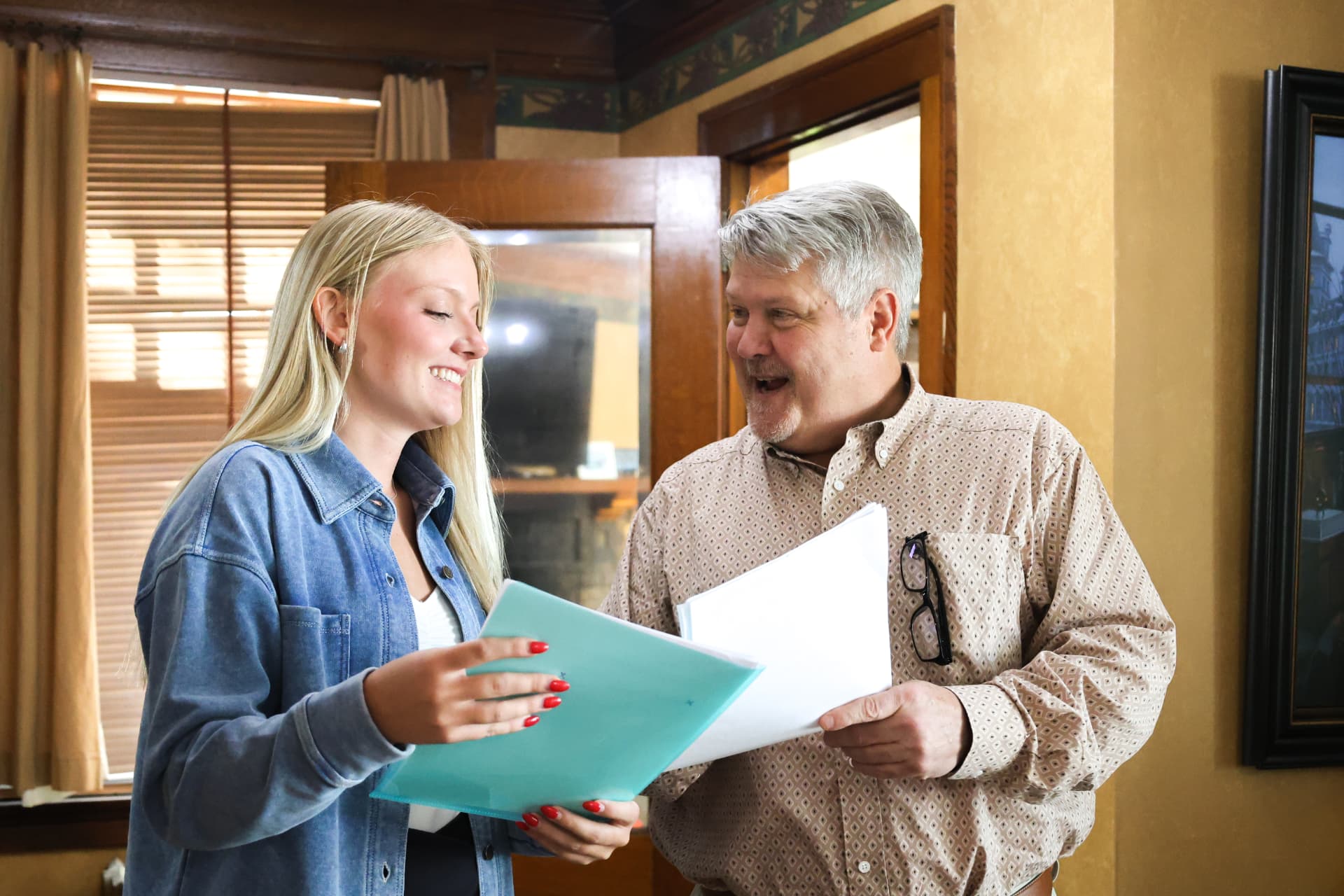 Birch Corp Health advisor and client reviewing Medicare and health insurance documents together